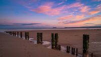 iStock-1273916576.jpg Youghal Beach a sunset