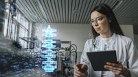 RESEARCH.jpg Female engineer with digital tablet examining development of industrial product