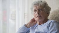 Senior woman indoors looking upset and bored