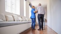 P2 Lead.jpg Nurse helping senior man walk using a walking stick