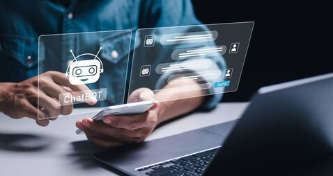 iStock-2078530699.jpg AI chat technology, Businessman use smartphone with virtual screen of AI chatbot communicate and answer questions. Artificial in