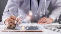 iStock-2199954663.jpg AI innovation in the medical field. Doctors use digital pens to record data on tablets. chatbot conversation customer service .