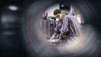 Engineers fixing a machine