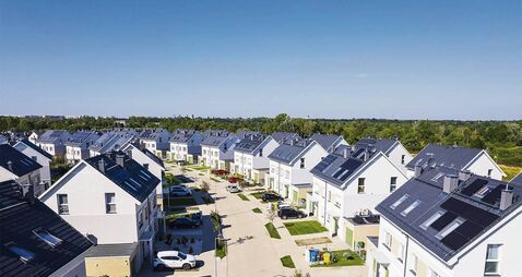 NewHomesTommyp25.jpg aerial view of solar panels on city or rural residential homes and neighborhoods