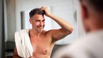 Happy Man Doing Hair Care Looking