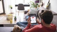 Man Shopping Electronics Online During Black Friday Sale.
