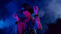 Photo of pretty girl shy cover face with transparent hood rainstorm protective garment over misty steam background