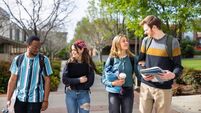 iStock-1465708279_students.jpg Diverse College Students Walking on Campus