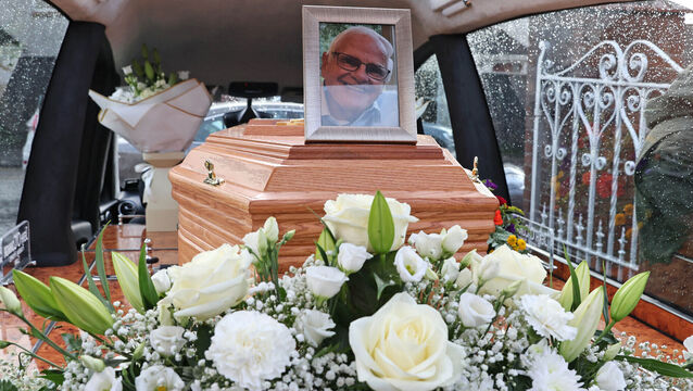 <p> A portrait of Seán Ó Sé on his coffin after his funeral Mass at Our Lady of Lourdes Church, Ballinlough Rd, Cork, on Friday. Pictures: Jim Coughlan</p>