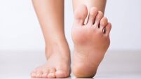 Closeup female foot pain, Healthcare concept.