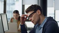 It developer overwork office closeup. Exhausted man project manager rubbing eyes