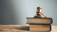 wooden judge on book on the desk