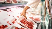 Buying meat at a supermarket.
